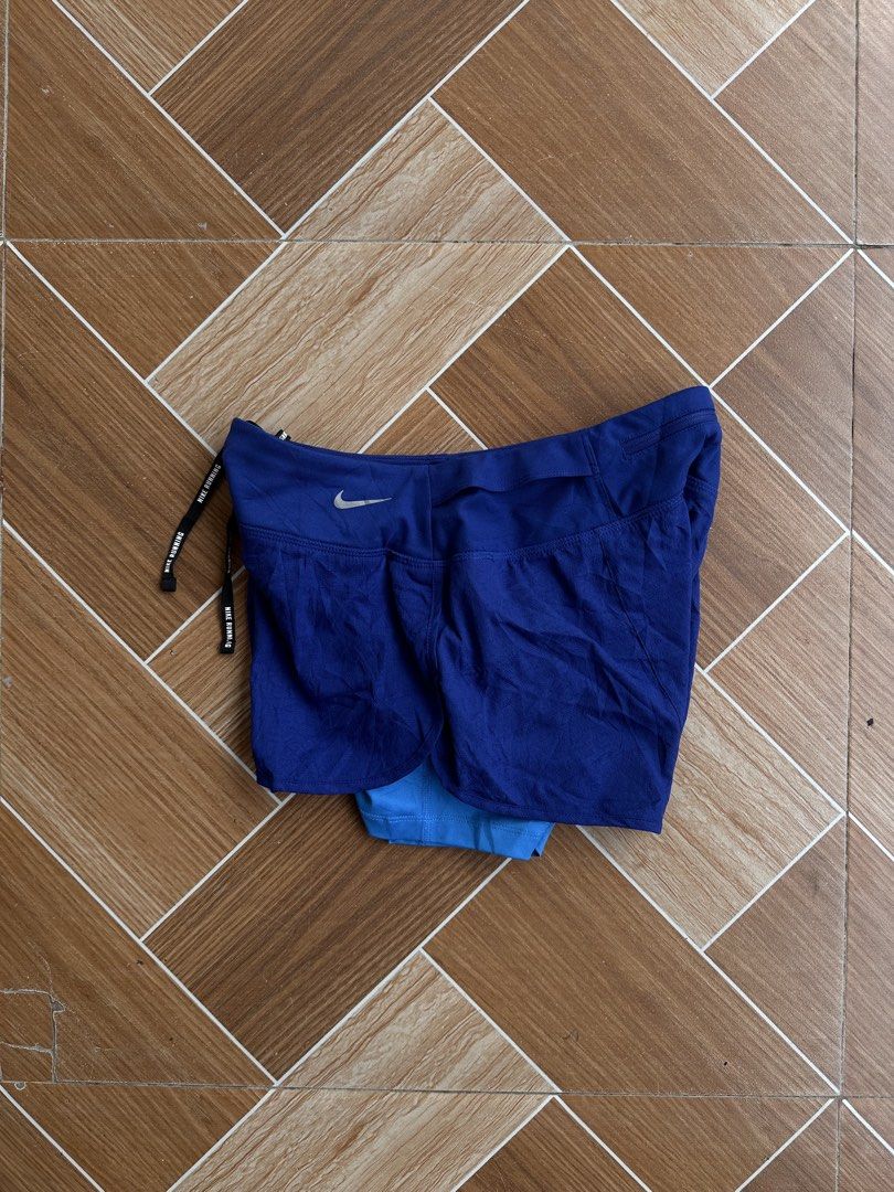 Nike Dri-FIT Blue Running Shorts with Inner Layer (Category: Activewear) located in Davao. Submitted by kurttyyo (Listing ID 1449600839, Image 3). Description: - Blue Nike running shorts - Size M - Inner layer for comfort and support - Dri-FIT material to keep you dry - Drawstring waist for adjustable fit - Ideal for workouts and runs.