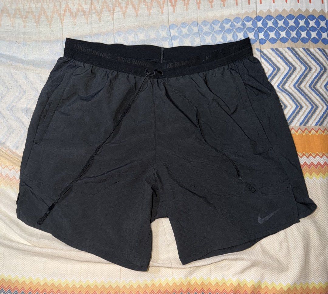 Nike Stride 5" Running Shorts (Category: Activewear) located in Manila. Submitted by spectral.ivot (Listing ID 1449687706, Image 1). Description: Size Medium, exact measurements: 14" Length, 5" Inseam, 12" Leg Opening Well used, reflectorizer has wear. Fabric is still like new. No lining Rfs: Decluttering.