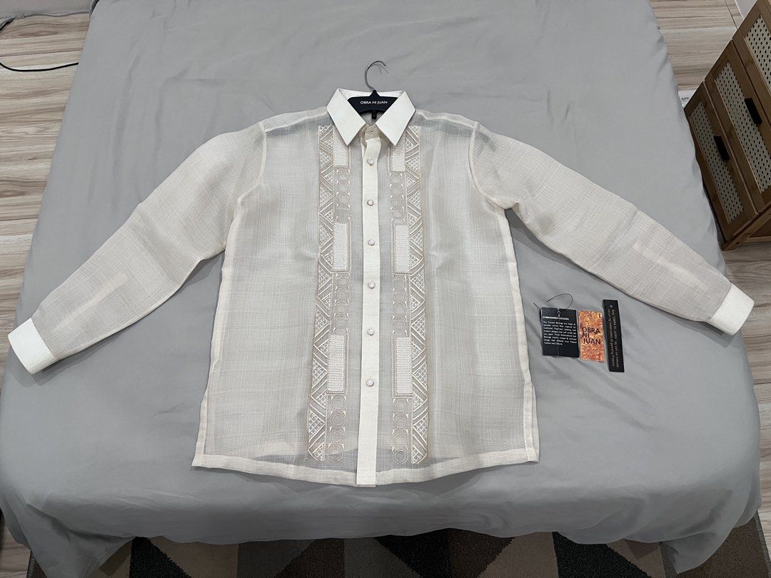 Obra Ni Juan Barong Tagalog (Category: Formal Shirts) located in Dasmarinas. Submitted by imjvsr (Listing ID 1449666411, Image 1). Description: - Authentic Obra Ni Juan Barong Tagalog - Used ony once (see photo) - Medium Size (for reference, I am 70kg and 5’5) - Complete with tag and hanger - Selling for 1k below market price.