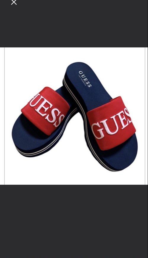 OG Guess Slides Navy Red White Logo Platform Sandals (Category: Slippers and slides) located in Quezon City. Submitted by letsdeclutter101 (Listing ID 1449616059, Image 3). Description: - Navy blue Guess slides - Red strap detail - White Guess logo across the top - Platform sole with white stripe - Comfortable and stylish for everyday wear - Ideal for pool or beach.