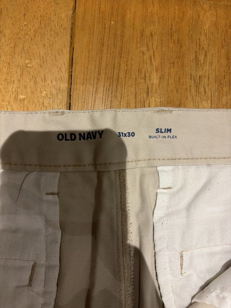 Old Navy Slim Fit Mens Pants (Category: Chinos) located in Quezon City. Submitted by purplepproni (Listing ID 1449682622, Image 2). Description: - Brand: Old Navy - Fit: Slim Fit - Size: 31x30 - Color: Light Grey - Features: Built-in flex for enhanced comfort - Style: Versatile for casual and smart casual occasions - Pairing: Easily matches with various tops.