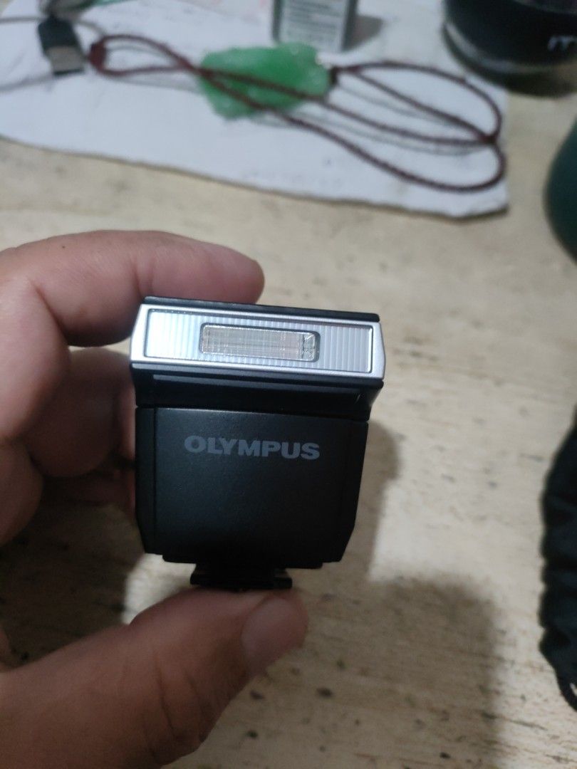 Olympus External Flash for Digital Cameras (Category: Cameras) located in Manila. Submitted by christbooth (Listing ID 1449542571, Image 1). Description: - Compact and portable Olympus external flash unit. - Features a simple ON/OFF switch and unlock button. - Hot shoe mount for easy attachment to compatible Olympus cameras. - Perfect for enhancing your photos with extra light. - Designed to work with compatible Olympus camera models..