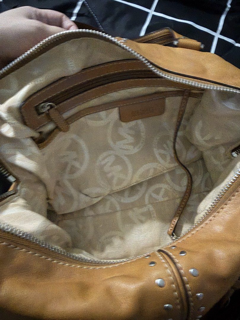 Orig M.K Leather Bag Studded with sling (Category: Cross-body Bags) located in Antipolo. Submitted by saphiraaa03 (Listing ID 1449623363, Image 3). Description: M.K Bag Original Money back if proven fake with signs of usage (preloved) but well taken care of. location: Lower Antipolo.