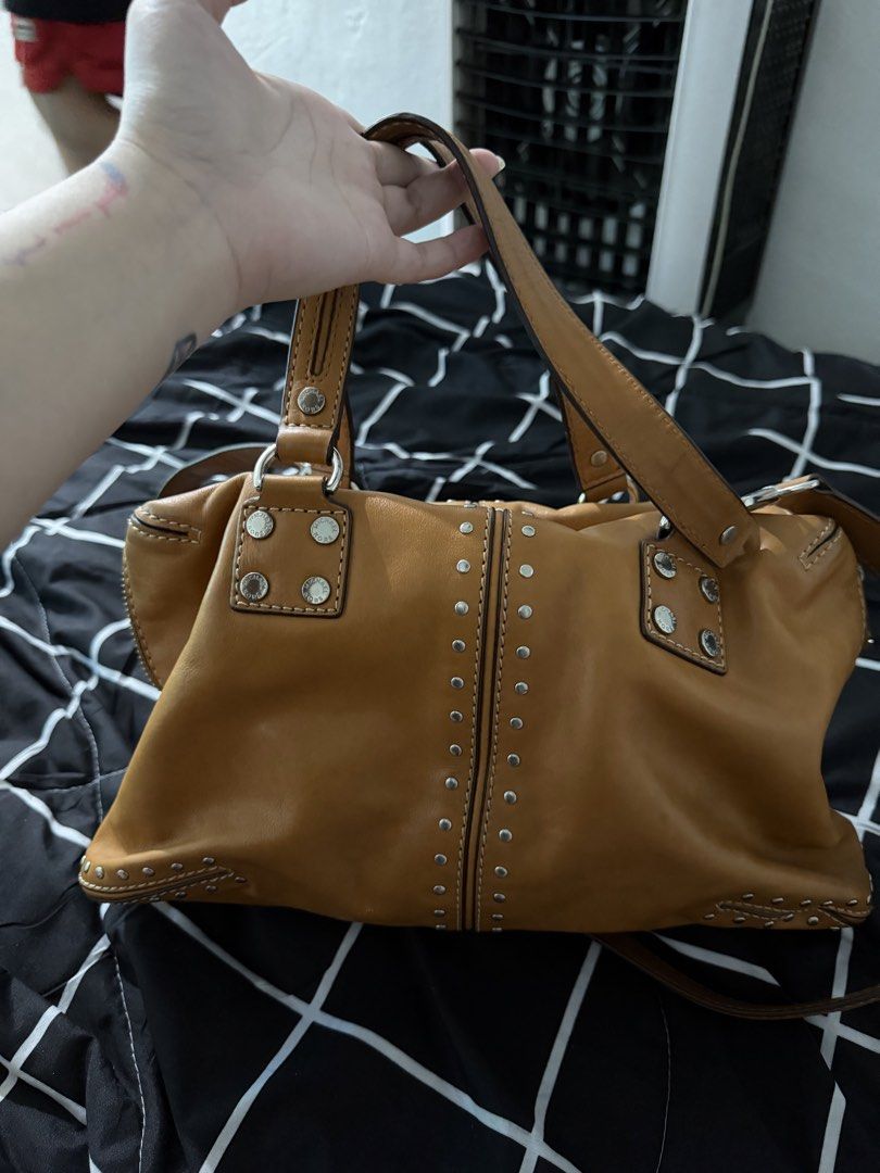 Orig M.K Leather Bag Studded with sling (Category: Cross-body Bags) located in Antipolo. Submitted by saphiraaa03 (Listing ID 1449623363, Image 2). Description: M.K Bag Original Money back if proven fake with signs of usage (preloved) but well taken care of. location: Lower Antipolo.