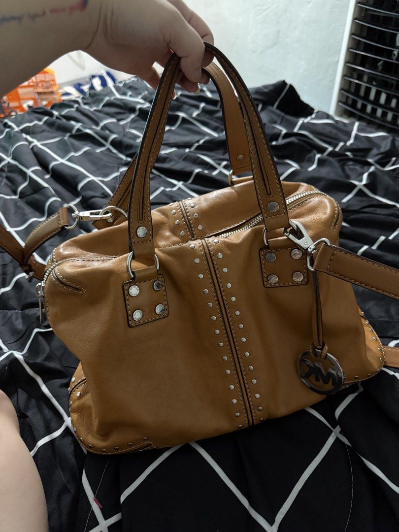 Orig M.K Leather Bag Studded with sling (Category: Cross-body Bags) located in Antipolo. Submitted by saphiraaa03 (Listing ID 1449623363, Image 1). Description: M.K Bag Original Money back if proven fake with signs of usage (preloved) but well taken care of. location: Lower Antipolo.