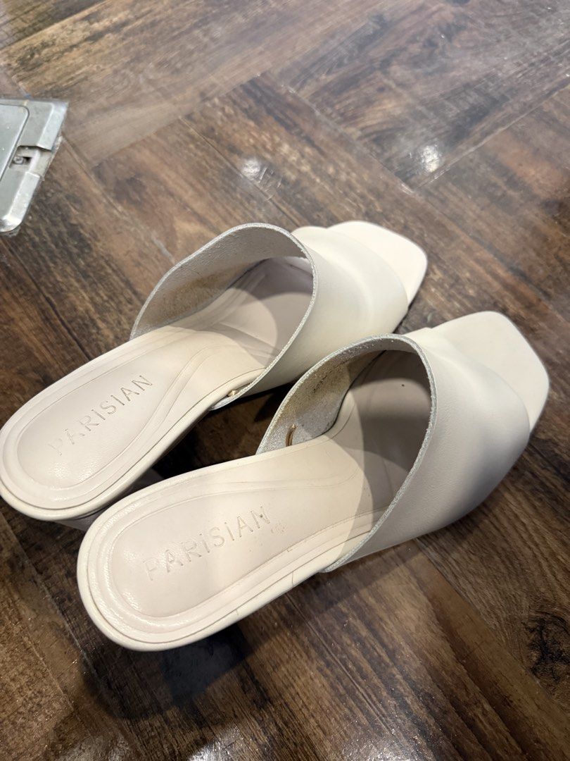 PARISIAN White Block Heel Mules Sandals (Category: Heels) located in Taguig. Submitted by preloved_bycarla (Listing ID 1449615830, Image 2). Description: - Style: White Mules - Design: Open-toe with block heel - Closure: Easy slip-on - Versatility: Perfect for dressing up or down Used only a few times Rfs: decluttering .