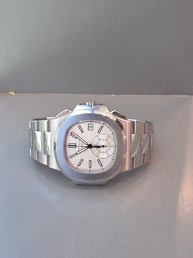 Patek Philippe Nautilus 5980/1A White Piano (Category: Watches) located in Singapore. Submitted by cabiin7 (Listing ID 1449552248, Image 1). Description: Patek philippe nautilus 5980 white piano. Mint condition, light hairline scratches. Full set dated 2013.