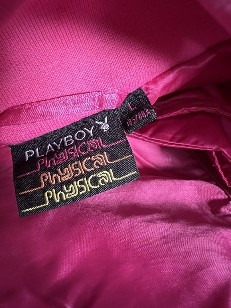 Playboy Physical Pink Windbreaker Jacket (Category: Coats, Jackets and Outerwear) located in Makati City. Submitted by annesexy (Listing ID 1449606820, Image 3). Description: - Pink Playboy windbreaker jacket - Features a hood - Stylish gold button details - Embroidered Playboy bunny logo on chest - Ideal for casual wear and light outdoor activities.