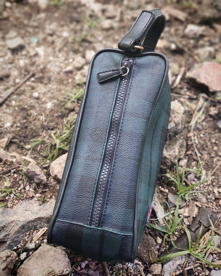 Polo Ralph Lauren Plaid Pouch Bag (Category: Purses & Pouches) located in Sipalay. Submitted by boldowl.e4f283 (Listing ID 1449558709, Image 2). Description: - Classic Polo Ralph Lauren pouch - Signature green and navy plaid pattern - Black trim and handle - Secure zipper closure - Small logo patch on the front - Ideal for organizing your essentials.