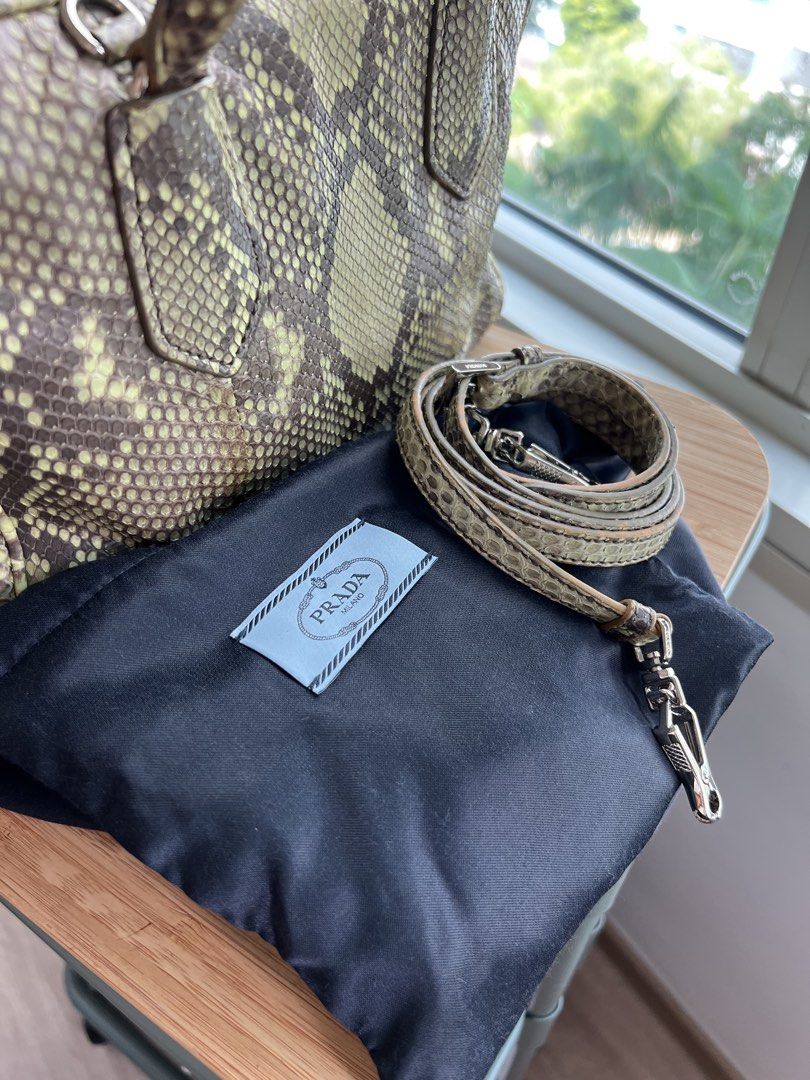 PRADA Python Skin (Category: Bags & Wallets) located in Singapore. Submitted by grace2610 (Listing ID 1449583008, Image 3). Description: 100% Authentic Exotic Python Skin Color : Pistachio Produced in limited quantities Condition : 9/10 (used once or twice) No signs of peeling / Dryness on skin Full Python exterior with full zipper Full calf leather interior - super soft and n pop color (pistachio) With detachable strap Can be carried on shoulder