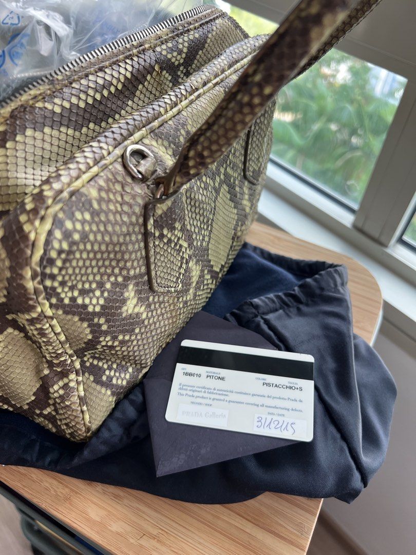 PRADA Python Skin (Category: Bags & Wallets) located in Singapore. Submitted by grace2610 (Listing ID 1449583008, Image 2). Description: 100% Authentic Exotic Python Skin Color : Pistachio Produced in limited quantities Condition : 9/10 (used once or twice) No signs of peeling / Dryness on skin Full Python exterior with full zipper Full calf leather interior - super soft and n pop color (pistachio) With detachable strap Can be carried on shoulder