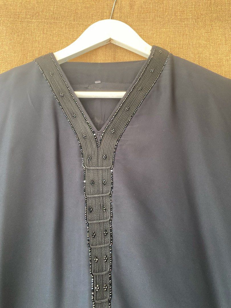 Preloved Abaya Nidha Simple (Category: Kaftans & Jubahs) located in Batu Pahat. Submitted by mierabell (Listing ID 1449570989, Image 3). Description: Preloved Abaya Nidha Simple 📝 Rm20 📌 Dada 52” | Labuh 54.5” 📌 Material Nidha 📌 Cutting : Straight 📌 Sarung Condition ok. Manik rhinestone di hujung lengan dan leher. Ade a few defect 1. Kesan iron ( tak nampak sangat) 2. ⁠Tercarik di bottom baju Harga exclusive postage 📌 postage SM Rm8, SS RM1