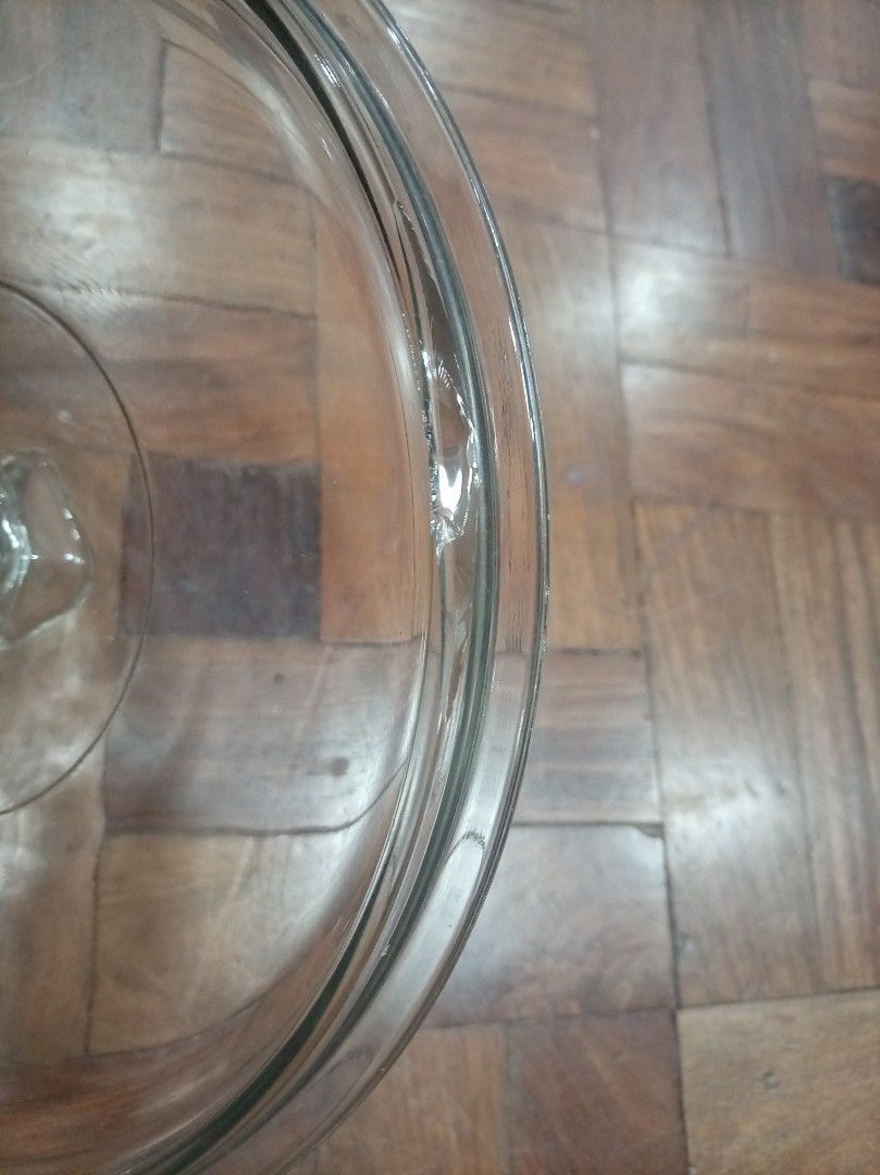 Anchor Glass Casserole Dish with Lid (Category: Cookware & Accessories) located in Makati City. Submitted by giovandbertha1 (Listing ID 1449700772, Image 3). Description: - Vintage Pyrex casserole dish - Clear glass with built-in handles - Includes matching glass lid - Ideal for baking and serving - Chip in inner part of lid - Minor signs of wear on the rim (see close-up photo) - Still a durable and functional kitchen essential.