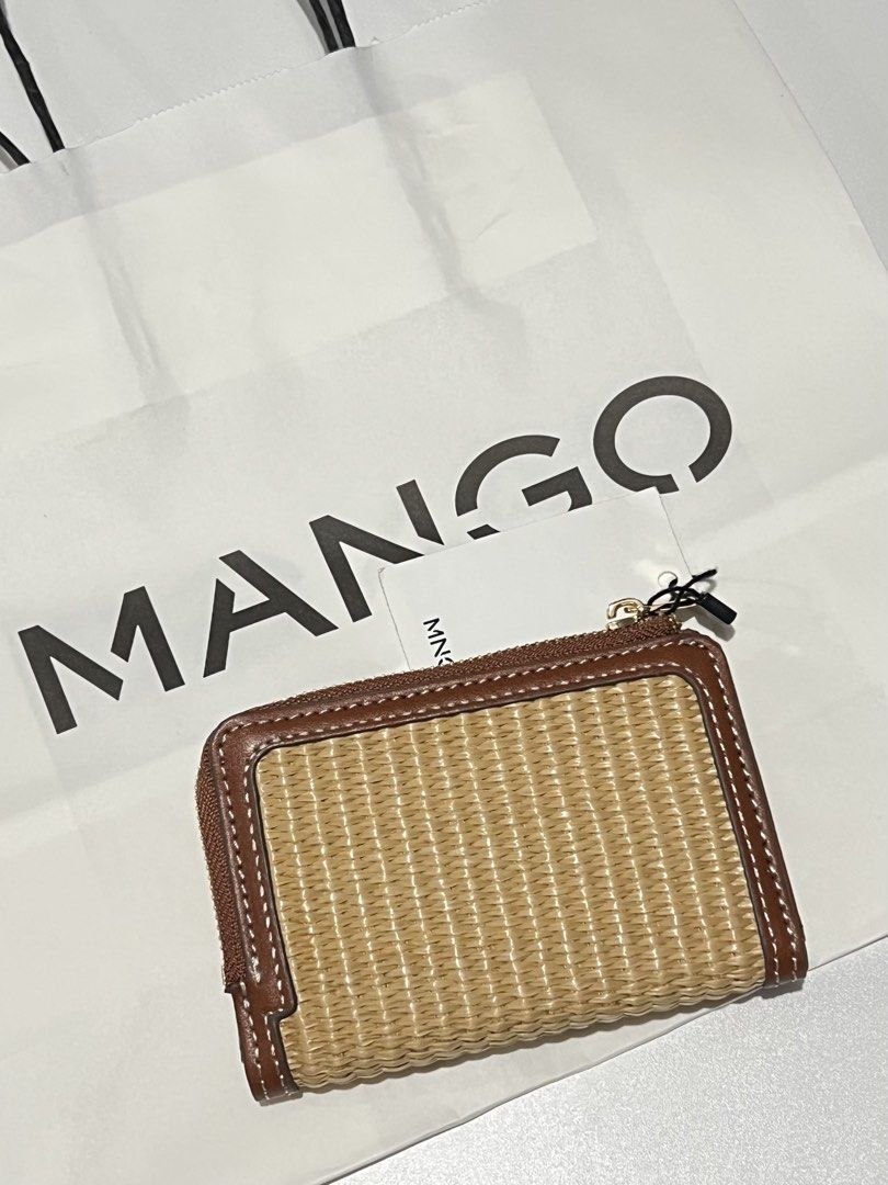 Rattan Style Mango Woven Straw & Leather Zip Around Wallet (Category: Wallets & Card holders) located in Las Pinas. Submitted by baediola (Listing ID 1449665643, Image 2). Description: Brand New With tag With paper bag No flaws - Cute woven straw wallet with brown leather trim. - Secure zip-around closure. - Interior features card slots and a button snap compartment. - Perfect for keeping your essentials organized. - Small and compact design..