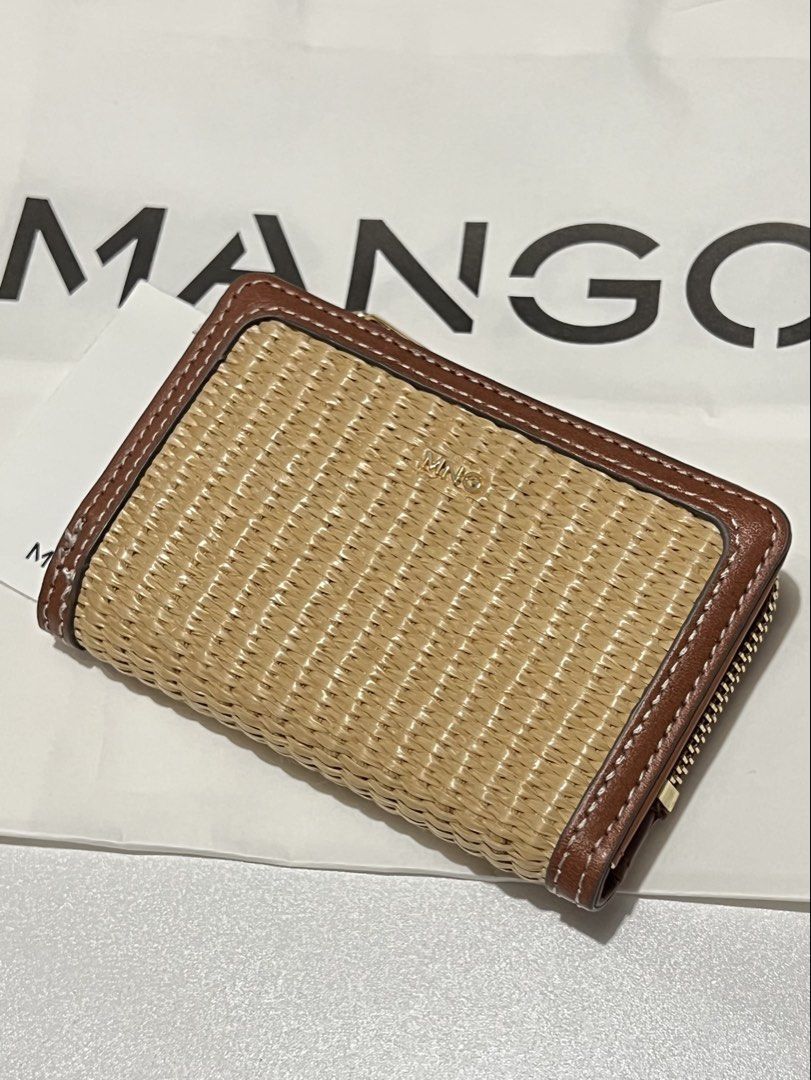 Rattan Style Mango Woven Straw & Leather Zip Around Wallet (Category: Wallets & Card holders) located in Las Pinas. Submitted by baediola (Listing ID 1449665643, Image 1). Description: Brand New With tag With paper bag No flaws - Cute woven straw wallet with brown leather trim. - Secure zip-around closure. - Interior features card slots and a button snap compartment. - Perfect for keeping your essentials organized. - Small and compact design..
