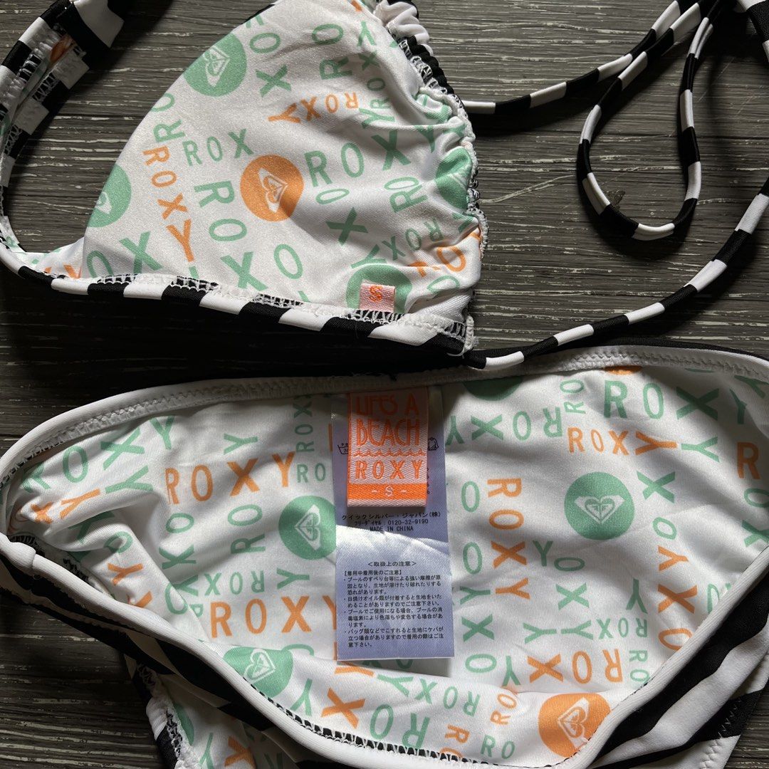 Roxy Black and White Striped Bikini (Category: Bikinis & Swimsuits) located in Baao. Submitted by lythrift2005935 (Listing ID 1449539402, Image 3). Description: - Cute Roxy bikini set - Black and white stripes - Fun Roxy pattern lining - Ties at neck and sides - Size S - Ideal for beach or pool.