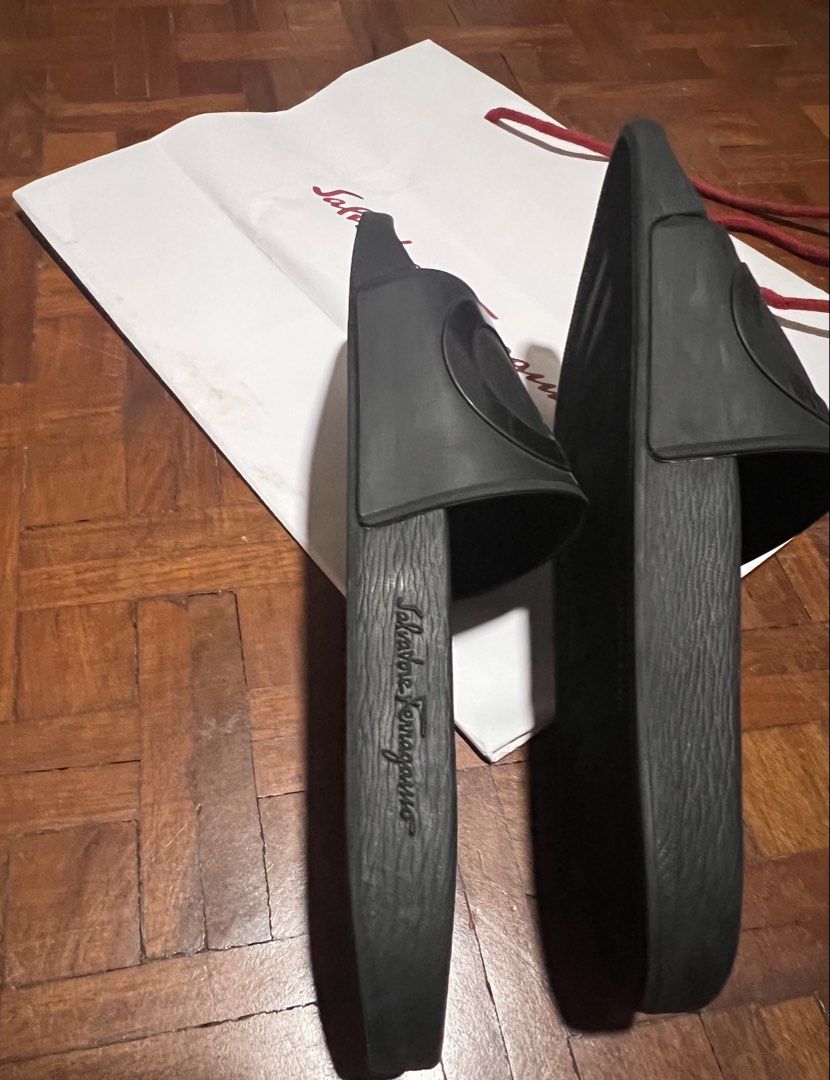 Salvatore Ferragamo Gancini Slides Black (Category: Slippers & Slides) located in Naga. Submitted by emteedee (Listing ID 1449566992, Image 3). Description: - Authentic Salvatore Ferragamo slides - used a few times only, 11.5 inches - Features the iconic Gancini logo - Made in Italy - Comes with paperbag - Ideal for casual wear.