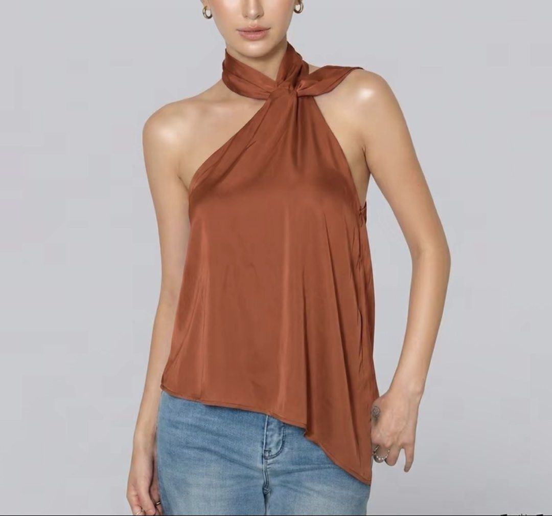 Satin Halter Neck Top - Brown (Category: Sleeveless) located in Pasay City. Submitted by psyche__ (Listing ID 1449711868, Image 1). Description: NEVER BEEN USED w/ tags and zip bag!! -Silky brown halter top - Unique twisted neckline - Asymmetrical hemline - Lightweight and flowy material - Versatile: great with jeans or dressed up - Perfect for nights out or special occasions RFS: Not my style & color! .