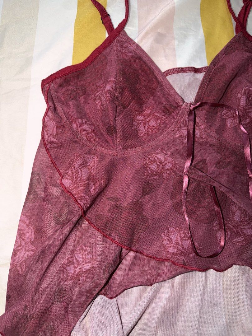 Sheer Rose Print Babydoll Top (Category: Blouses) located in Cainta. Submitted by m4rie_ (Listing ID 1449637869, Image 2). Description: - Burgundy sheer babydoll top - All-over rose print - Adjustable spaghetti straps - Ribbon tie detail at the bust - Ruffled hemline - Lightweight and flowy fabric - Ideal for layering or casual wear RFS: Decluttering Best fits: Medium No defects. Notes: * Items are washed and/or sanitized before shipping. * Color