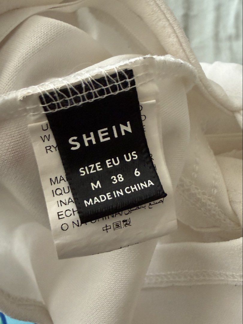 SHEIN White Corset Top with Tie Straps (Category: Sleeveless) located in Quezon City. Submitted by crystalivory (Listing ID 1449633042, Image 3). Description: - White corset top from SHEIN - Features adjustable tie-up straps - Structured bodice with boning for a flattering fit - Versatile: pairs well with jeans or skirts - Comfortable and stylish for any occasion - stain on chest area but removable.