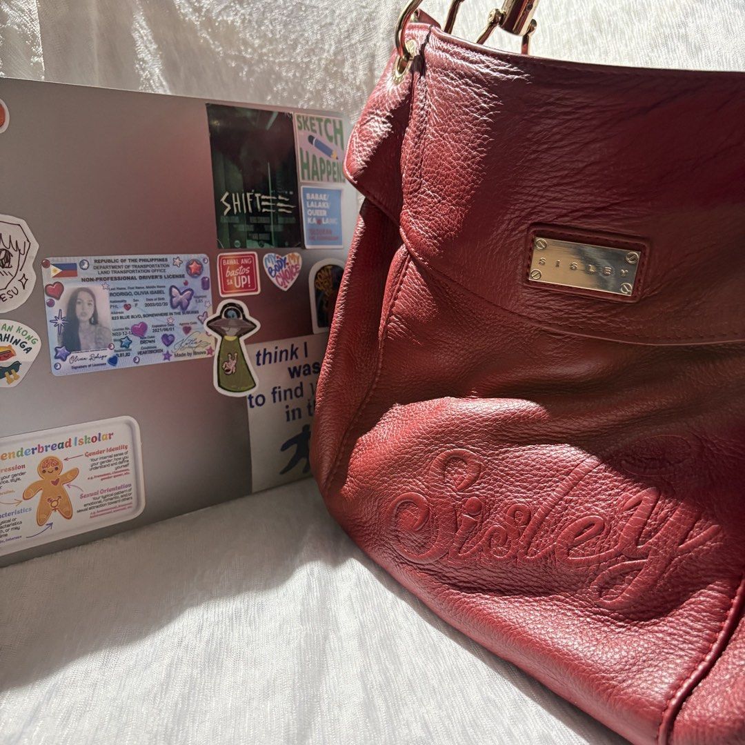 SISLEY Red Leather Hobo Bag (Category: Shoulder Bags) located in Mandaluyong City. Submitted by aestephics (Listing ID 1449606729, Image 2). Description: rfs need student funds! for inquiries, message anytime note: kindly manage your expectations for pre-loved items. loc: mandaluyong city near rtu mop gcash or maya shipping via lalamove, j&t, or angkas padala.