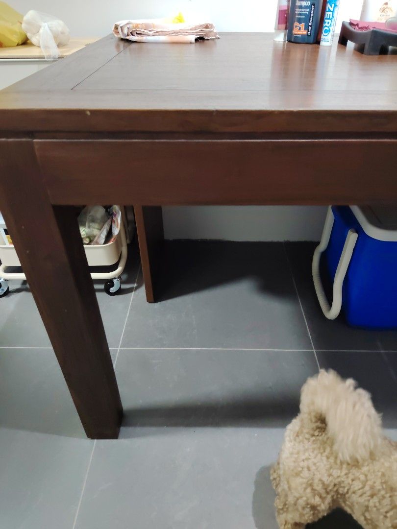 Solid Wood Dining Table (Category: Tables & Sets) located in Singapore. Submitted by cassie_12 (Listing ID 1449668355, Image 1). Description: - Solid wood dining table - Dark brown finish - Rectangular shape - Seats 6 to 8 person - solid wood - extendable.