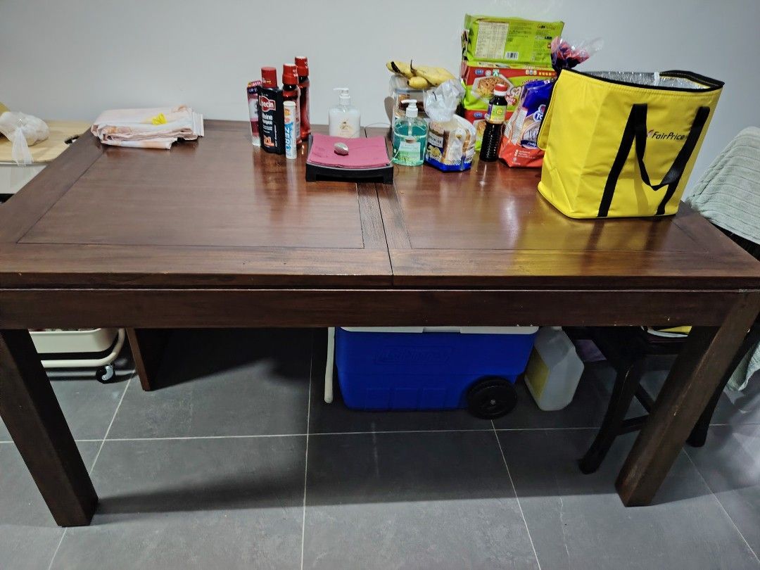 Solid Wood Dining Table (Category: Tables & Sets) located in Singapore. Submitted by cassie_12 (Listing ID 1449668355, Image 2). Description: - Solid wood dining table - Dark brown finish - Rectangular shape - Seats 6 to 8 person - solid wood - extendable.