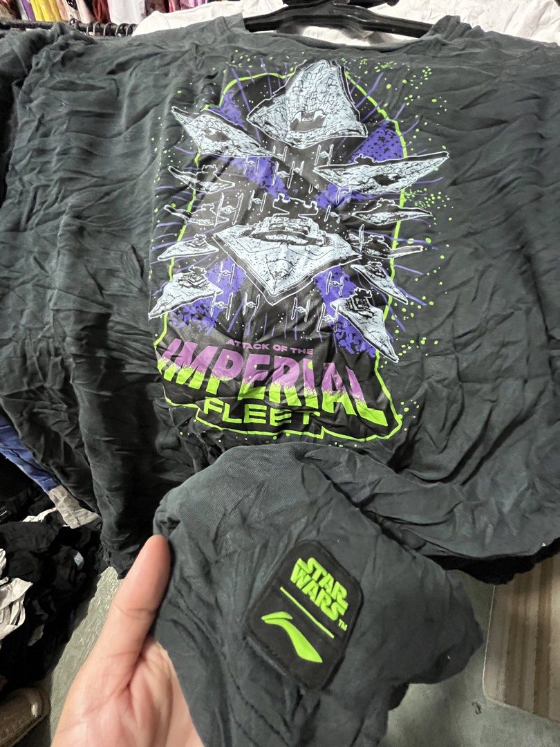 Star Wars Imperial Fleet T-Shirt (Category: Tshirts & Polo Shirts ) located in Quezon City. Submitted by casabalerica (Listing ID 1449629957, Image 2). Description: - Black t-shirt featuring a striking Star Wars Imperial Fleet graphic. - Graphics include Star Destroyers and TIE fighters on both front and back. - Subtle Star Wars logo detail on the sleeve. - Made from comfortable, everyday wear fabric. - An essential item for any Star Wars enthusi