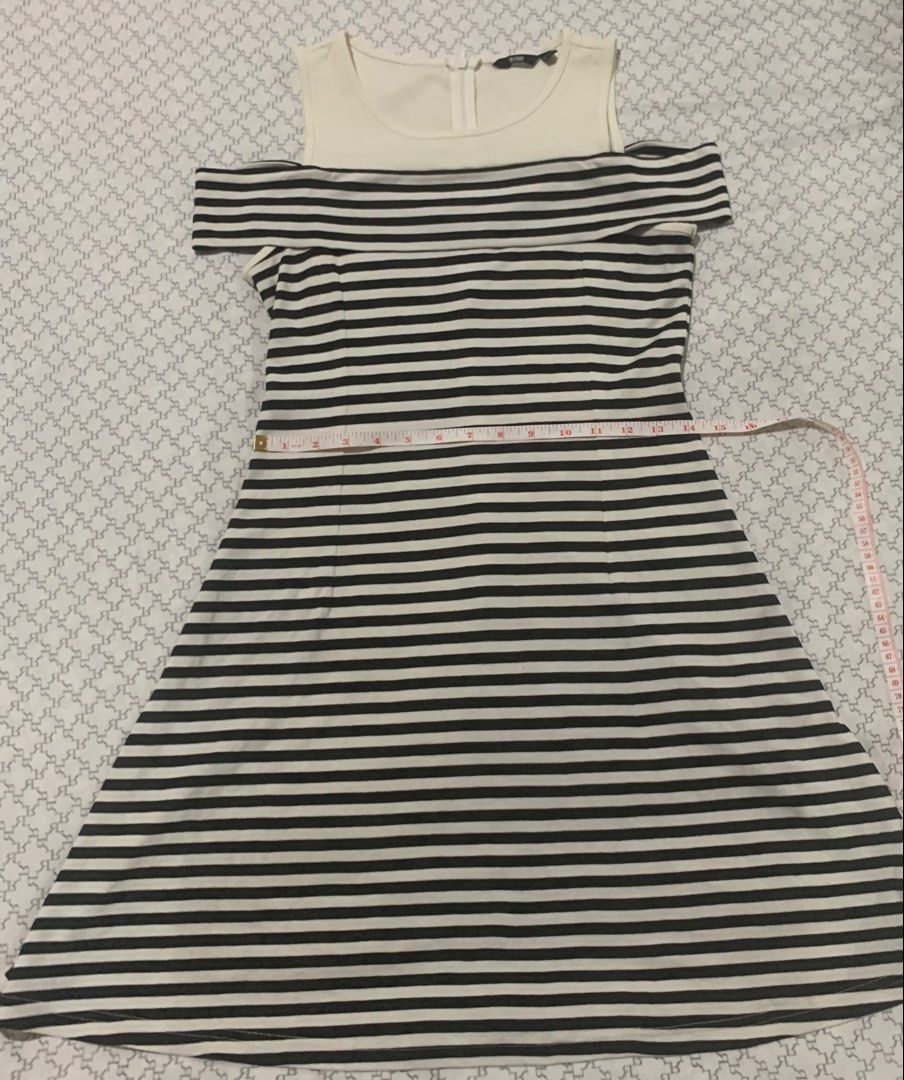 Striped Cold Shoulder Dress (Category: Dresses) located in Paranaque City. Submitted by vbvessentials (Listing ID 1449704988, Image 3). Description: - Stylish cold shoulder design - Black and white striped skirt - Convenient back zipper closure - Approx. 34 inches in length - Approx. 28 inches at the waist - Ideal for casual outings and everyday wear -large on tag but fits medium frame.
