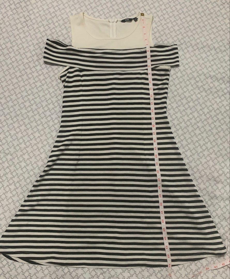 Striped Cold Shoulder Dress (Category: Dresses) located in Paranaque City. Submitted by vbvessentials (Listing ID 1449704988, Image 2). Description: - Stylish cold shoulder design - Black and white striped skirt - Convenient back zipper closure - Approx. 34 inches in length - Approx. 28 inches at the waist - Ideal for casual outings and everyday wear -large on tag but fits medium frame.