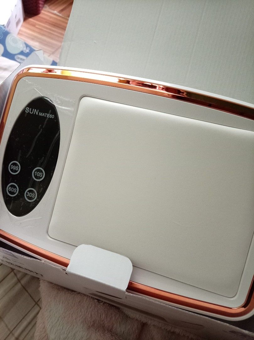 SUN MATE Nail Lamp with Timer Settings (Category: Hands & Nails) located in Quezon City. Submitted by happytiger_97119b (Listing ID 1449716326, Image 1). Description: - Sun Mate Nail Lamp - Available in White and Rose Gold - Timer settings: 10s, 30s, 60s, 99s - Ideal for curing gel polish - Compact and portable design.