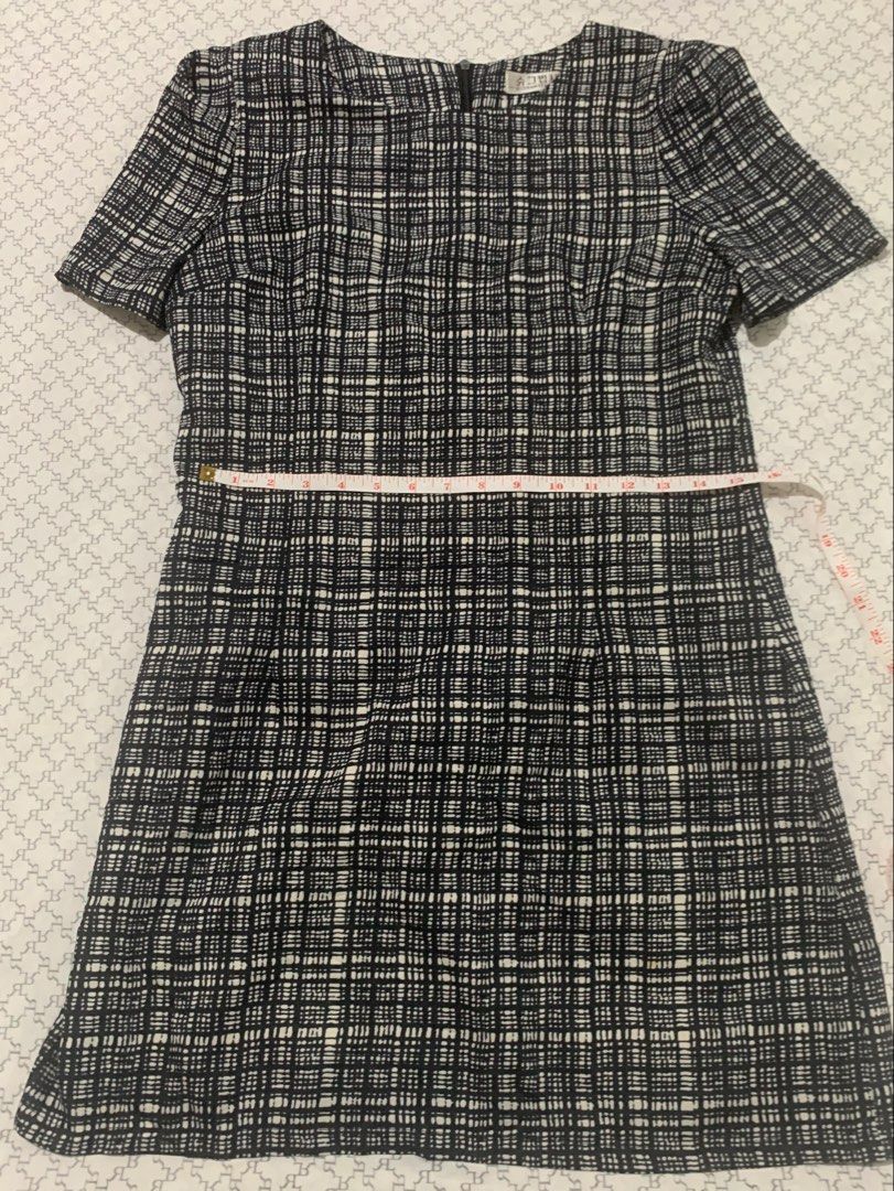 Tweed Pattern Short Sleeve Dress (Category: Dresses) located in Paranaque City. Submitted by vbvessentials (Listing ID 1449702305, Image 2). Description: - Classic tweed pattern dress - Short sleeves - Simple silhouette - Back zipper closure - Versatile for work or casual outings - Measurements: Pit to pit 17 inches, length 33 inches - Fits like a small.