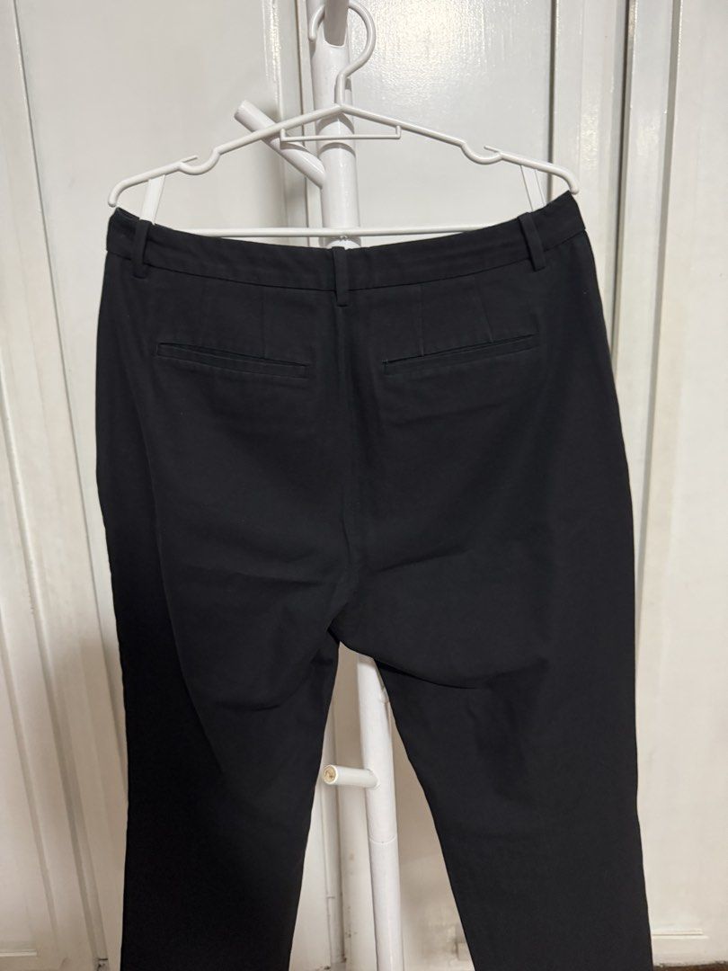 Uniqlo Black Straight Leg Pants (Category: Jeans) located in Quezon City. Submitted by chideclutters (Listing ID 1449649080, Image 2). Description: - Uniqlo Black Straight Leg Pants - Size: 73cm waist, 99cm hip - Material: Cotton, Polyester, Spandex blend - Versatile: Ideal for work or casual outfits - Design: Simple and classic.