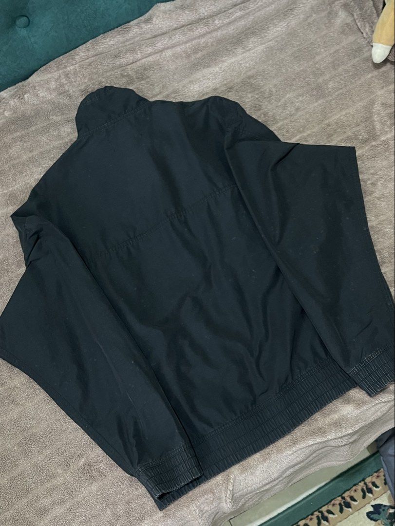 NIKE Jordan Black Quarter-Zip Pullover Windbreaker Embroidered Spellout (Category: Coats, Jackets and Outerwear) located in Seremban. Submitted by champagnepapi_turtle (Listing ID 1449586353, Image 2). Description: Negotiable Jordan Brand (Nike). The specific neck tag featuring the spaced-out “J O R D A N”, the center Jumpman, and “EST. 1985” below is highly characteristic of 2000s (Y2K) era apparel. Style: Quarter-zip (or half-zip) pullover jack