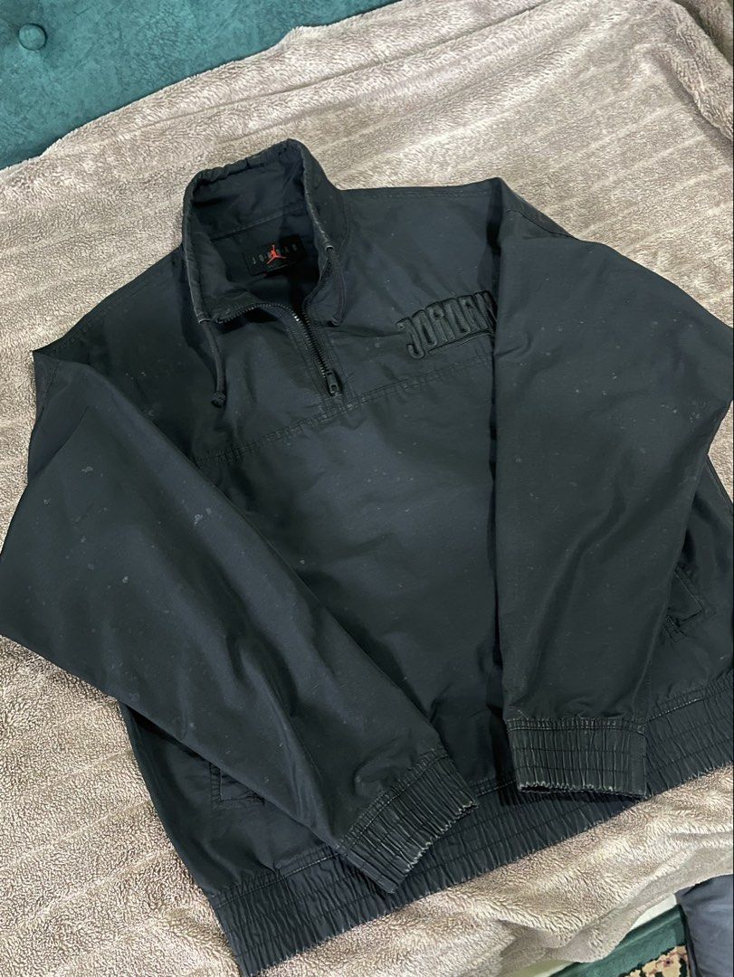 NIKE Jordan Black Quarter-Zip Pullover Windbreaker Embroidered Spellout (Category: Coats, Jackets and Outerwear) located in Seremban. Submitted by champagnepapi_turtle (Listing ID 1449586353, Image 1). Description: Negotiable Jordan Brand (Nike). The specific neck tag featuring the spaced-out “J O R D A N”, the center Jumpman, and “EST. 1985” below is highly characteristic of 2000s (Y2K) era apparel. Style: Quarter-zip (or half-zip) pullover jack