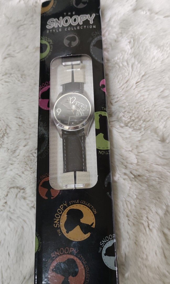 Vintage Snoopy Watch, Black Dial, Leather Strap, Licensed Peanuts (Category: Character Goods) located in Cavite. Submitted by dextermanalo28 (Listing ID 1449597184, Image 1). Description: Vintage Snoopy Watch, Black Dial, Leather Strap, Licensed Peanuts The strap needs to be replaced because it's peeling. Adult size watch WORKING✅.