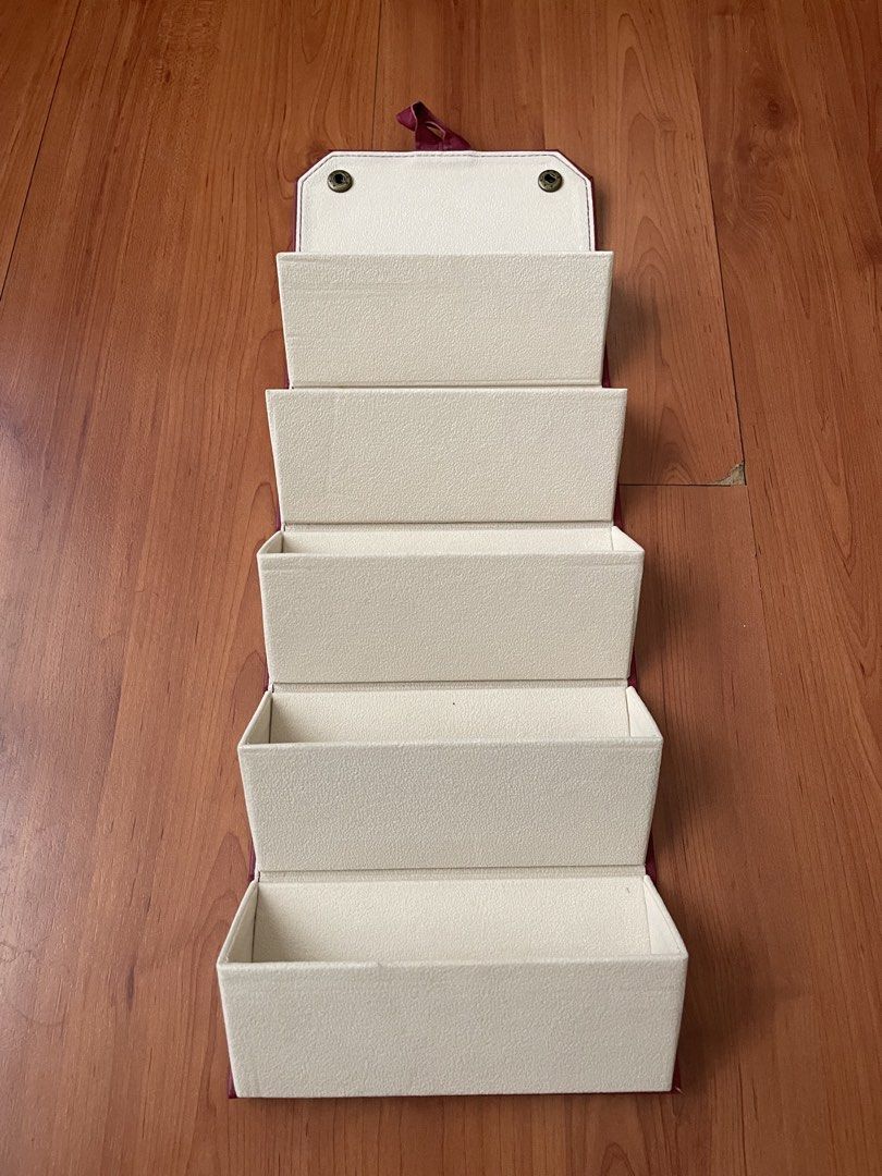 Vision Express Foldable Eyeglasses/Sunglasses Organizer (Category: Storage Boxes & Baskets) located in Quezon City. Submitted by greenteaslush (Listing ID 1449535773, Image 2). Description: - Vision Express foldable storage - red exterior, cream interior - multiple compartments - can be organizing jewelry, accessories, eyeglasses, sunglasses - folds flat, convenient storage - snap button closure 10/10 condition, never used .