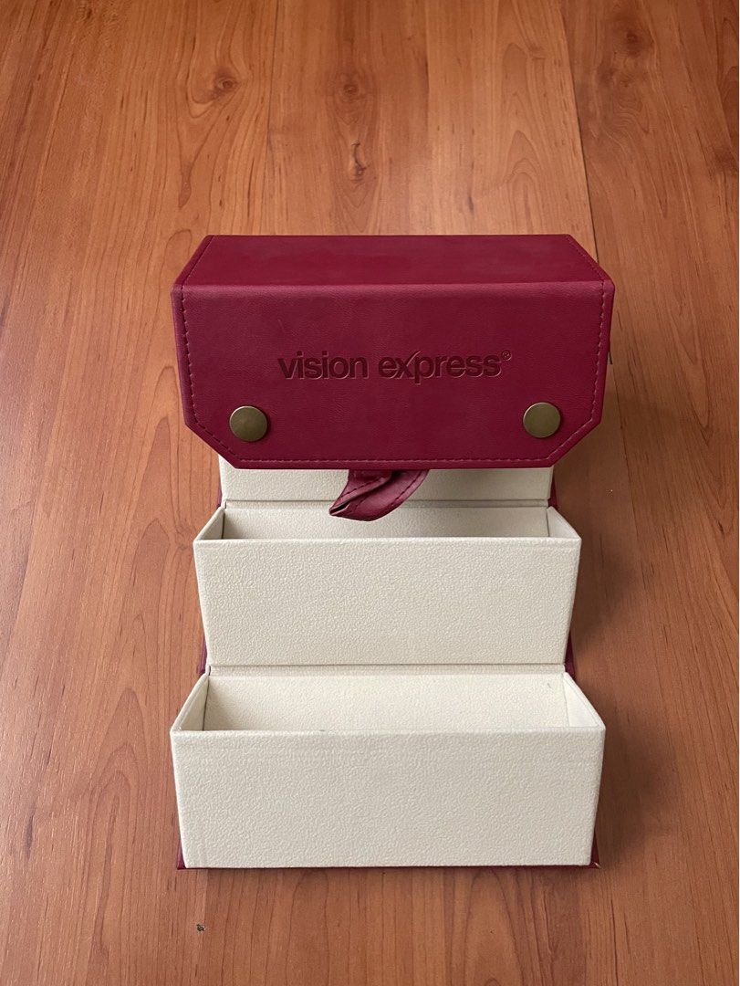 Vision Express Foldable Eyeglasses/Sunglasses Organizer (Category: Storage Boxes & Baskets) located in Quezon City. Submitted by greenteaslush (Listing ID 1449535773, Image 1). Description: - Vision Express foldable storage - red exterior, cream interior - multiple compartments - can be organizing jewelry, accessories, eyeglasses, sunglasses - folds flat, convenient storage - snap button closure 10/10 condition, never used .