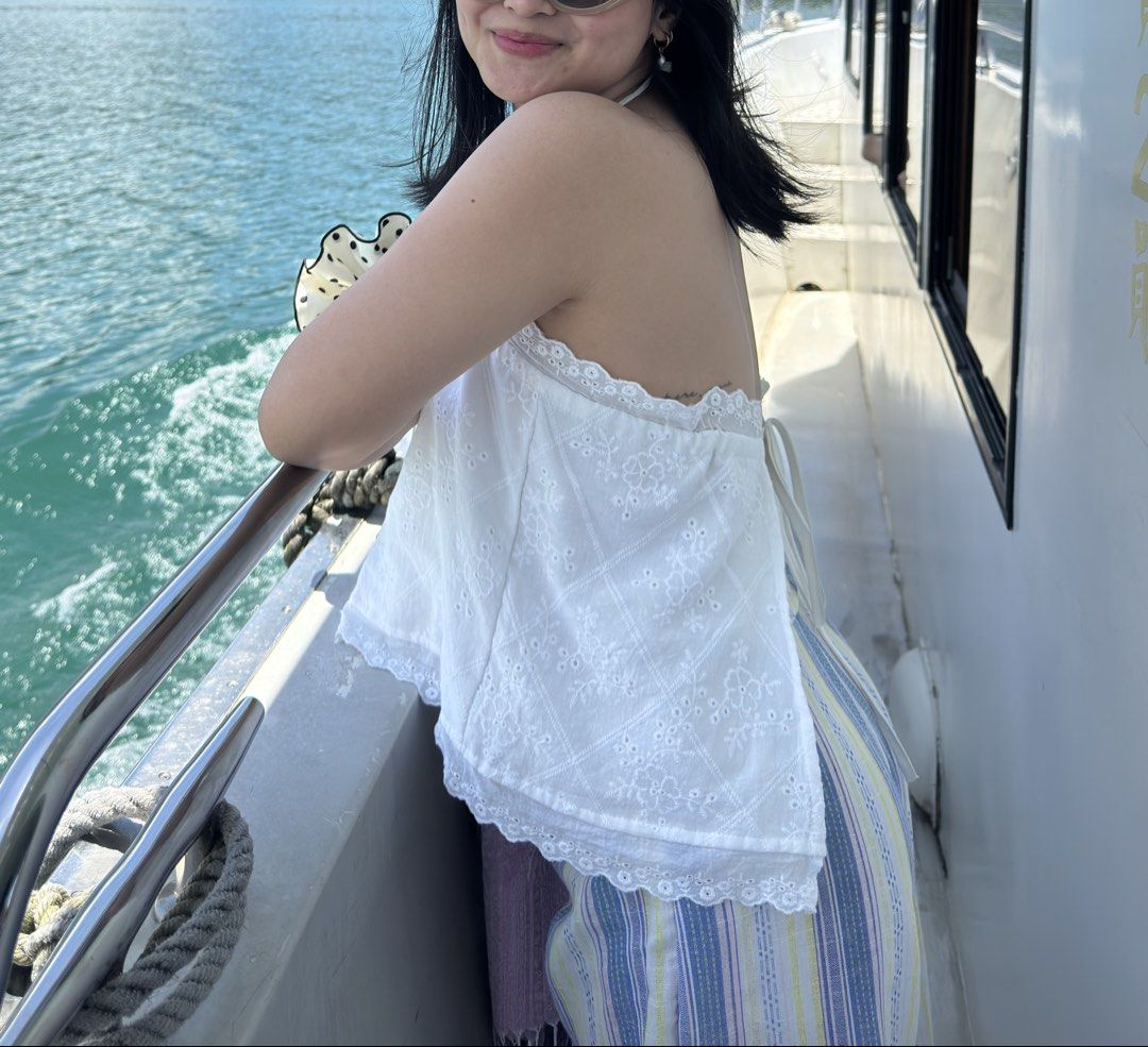 White eyelet summer top (Category: Sleeveless) located in Tuguegarao City. Submitted by declutterf (Listing ID 1449595179, Image 2). Description: White eyelet top that’s so pretty when worn I cut the straps so I can tie it around my neck (better imo) Actual when worn posted Bought in thailand Helping tags: zara, h&m, uniqlo.