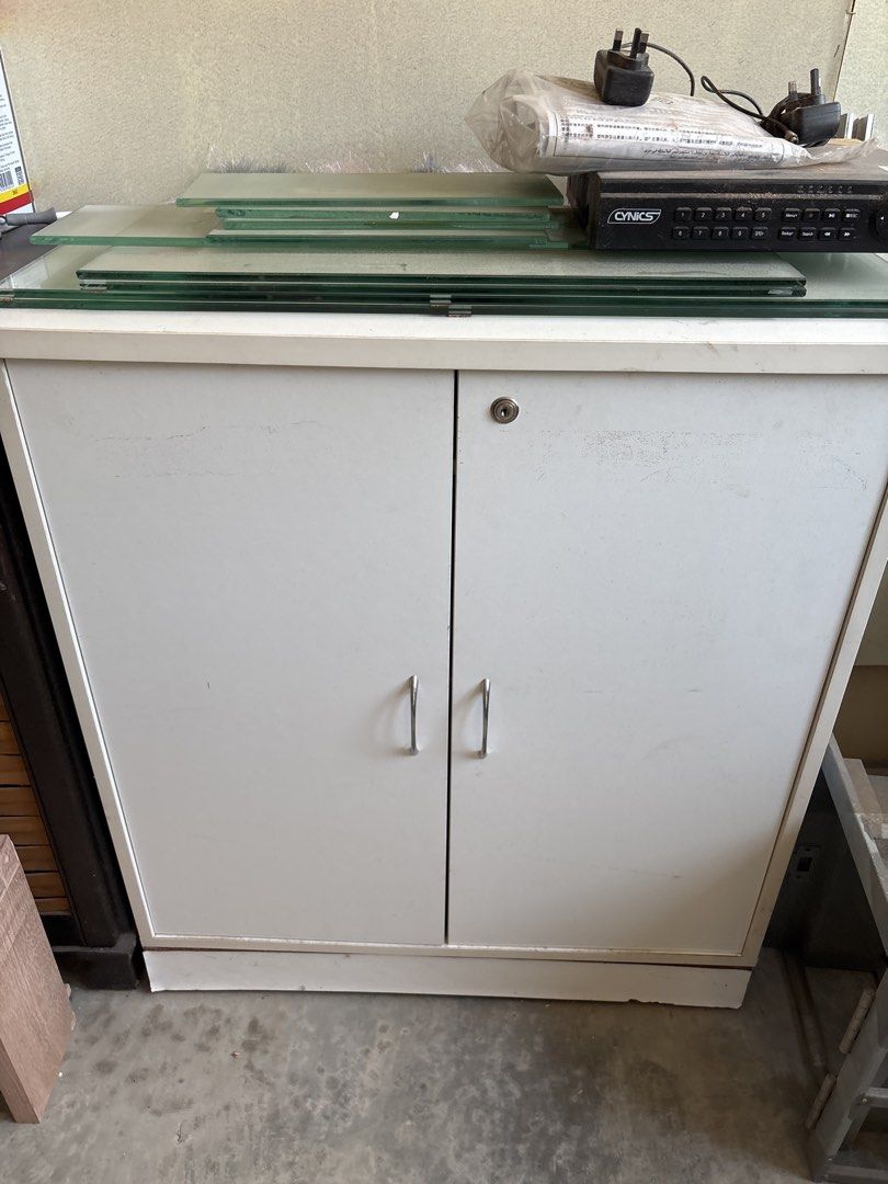 White Cabinet (Category: Shelves, Cabinets & Racks) located in Kuala Lumpur. Submitted by shopoholicmaniac (Listing ID 1449545379, Image 1). Description: - Features two doors with a lock and two handles - Ideal for organizing and storage.