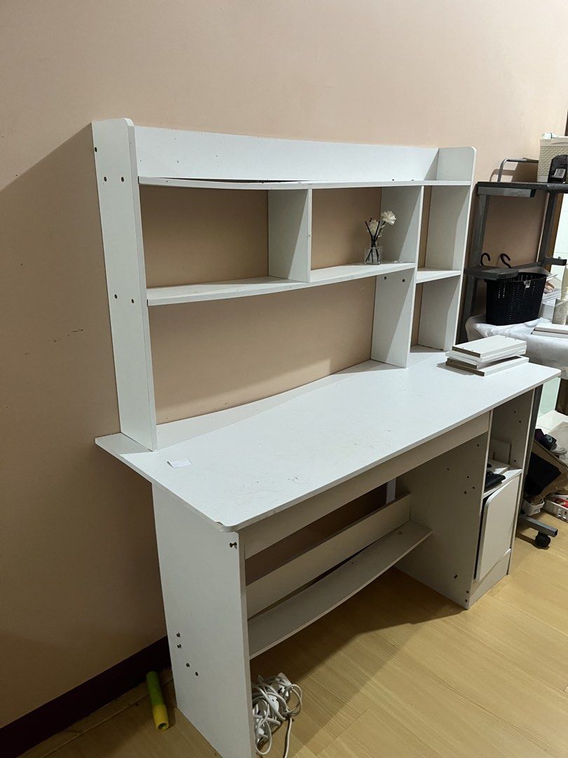 White Study Desk with Hutch and Shelving (Category: Tables & Sets) located in Bacoor. Submitted by danshari.store (Listing ID 1449731866, Image 2). Description: White study desk with a hutch. Lots of shelving space above the desk. There are also shelves below the desk surface. A small drawer unit is on the right side. Great for organizing your workspace. Measures approximately 120cm wide. Loc: One Archers Place Taft Avenue.