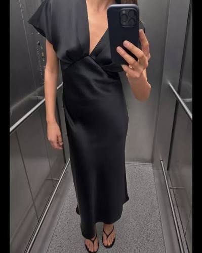 ZARA Satin Midi Dress | Black Medium (Category: Dresses) located in Quezon City. Submitted by mer.declutters (Listing ID 1449582129, Image 3). Description: - Flowy black satin midi dress - Flattering V-neckline - Delicate flutter sleeves - Beautiful fabric sheen - Versatile: dress up or down - Perfect for events or a night out - Comfortable and chic Haven’t had the chance to wear it pa! Tagged probably removed na. V-neck dress with pleats and sho