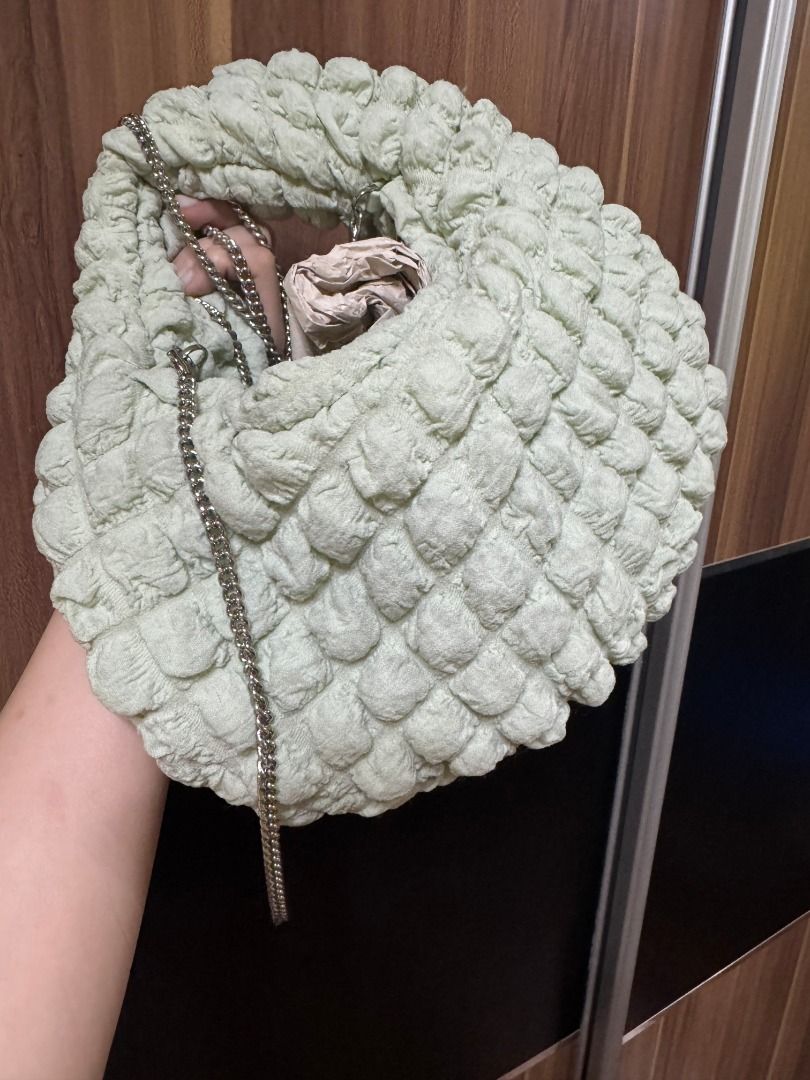 Zara Textured Round Bag Light Green (Category: Cross-body Bags) located in Quezon City. Submitted by declutterwithsk (Listing ID 1449637201, Image 3). Description: ✨ Zara Puffy Bag – Mint Green ₱500 Selling my Zara Puffy Bag in Mint Green. Barely used and still in good condition. It has a few stains from storage after being kept beside other bags, but they do not affect its functionality. ✅ Inclusions: — Original bag — Silver chain strap 📍 Locat