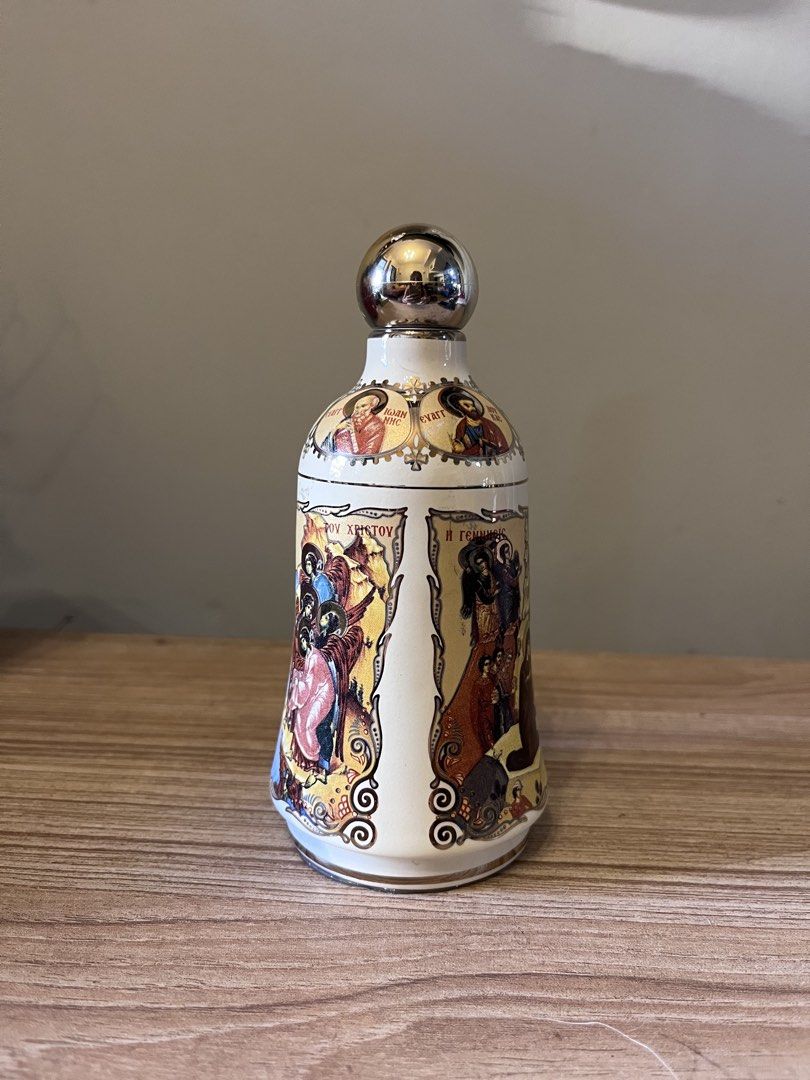 24K Gold Hand Painted Holy Water Bottle (Empty) (Category: Vintage Collectibles) located in Quezon City. Submitted by metamerchant (Listing ID 1449839255, Image 2). Description: - Ceramic bell with religious icons - Depicts scenes from the Bible, including the Nativity and Baptism of Christ - Base features Greek inscriptions - Ideal for display or as a unique collectible - Empty bottle - Size: 14cm Tall and 6.5cm width -Condition / Issue: Empty b