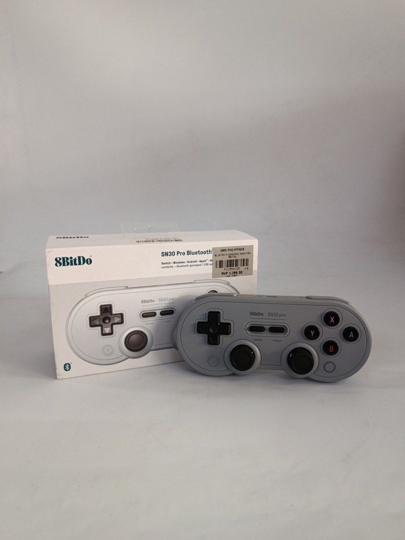 8BitDo SN30 Pro Bluetooth Gamepad (Category: Controllers) located in Mabalacat. Submitted by yuanisalone (Listing ID 1449879356, Image 1). Description: - 8BitDo SN30 Pro Bluetooth Gamepad - Compatible with: Switch, Windows, Android, Apple, Steam - Includes: Bluetooth gamepad - Condition: Tested and working - Perfect for retro or modern gaming RFS: Impulse purchase.