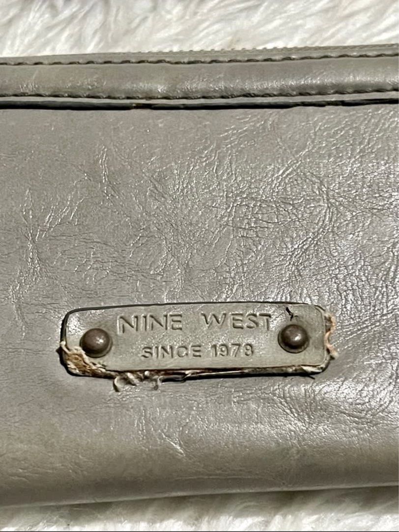 A-026 Nine West Grey Studded Zip Around Wallet (Category: Wallets & Card holders) located in Bayambang. Submitted by foursiblings081228 (Listing ID 1449838785, Image 3). Description: - Grey Nine West wallet - Features star and stud details - Zip around closure for security - Multiple interior card slots and compartments - Plenty of life left, still very functional.