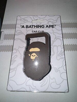 A Bathing Ape (BAPE) cap clip (Category: Luxury Accessories) located in Pasay City. Submitted by slideph (Listing ID 1449754459, Image 2). Description: - Authentic A Bathing Ape (BAPE) Cap Clip - Imported directly from Japan - Features the iconic BAPE Ape Head logo - Durable carabiner-style clip for easy attachment - Perfect for securing caps to bags, belts, or luggage - Comes sealed on original BAPE branded packaging FREE SHIP!.