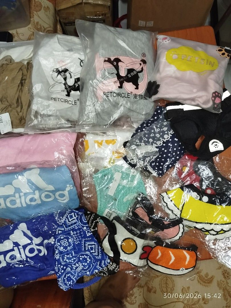 Adidog & Petcircle Pet Clothes Bundle (Category: Homes & Other Pet Accessories) located in Quezon City. Submitted by chadrison (Listing ID 1449917181, Image 2). Description: - Bundle of cute pet clothes for your furry friend. - Includes Adidog branded items: blue bandana and light blue towel. - Features Petcircle shirts in grey, white, and pink. - Fun designs like sushi and fried egg. - Various sizes available. - All items are individually packag