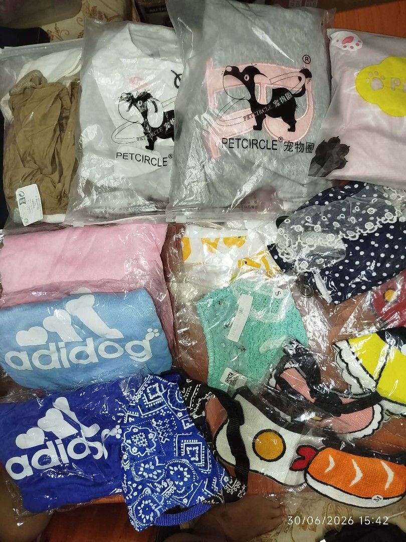 Adidog & Petcircle Pet Clothes Bundle (Category: Homes & Other Pet Accessories) located in Quezon City. Submitted by chadrison (Listing ID 1449917181, Image 3). Description: - Bundle of cute pet clothes for your furry friend. - Includes Adidog branded items: blue bandana and light blue towel. - Features Petcircle shirts in grey, white, and pink. - Fun designs like sushi and fried egg. - Various sizes available. - All items are individually packag