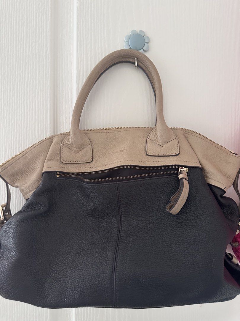 Anthem Two-Tone Leather Tote Bag (Category: Tote Bags) located in Antipolo. Submitted by waco1313 (Listing ID 1449788737, Image 1). Description: - Stylish black and beige leather Anthem handbag - Contrasting beige top handles - Secure zip closure for the main compartment - Convenient exterior zip pocket - Elegant gold hardware details - Ample interior space for everyday essentials - Ideal for daily use.
